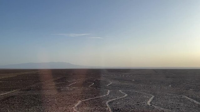 Nasko lines in peruvian desert, ancient signs, extraterrestrial civilization, view from the bus, amateur