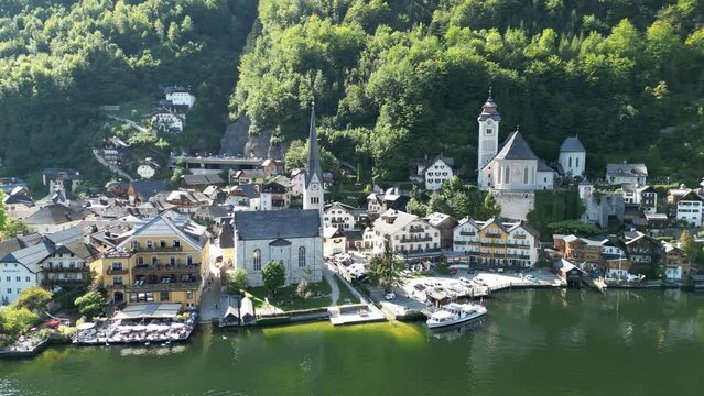 Pan drone aerial  waterfront Hallstatt Austria beautiful lakeside village