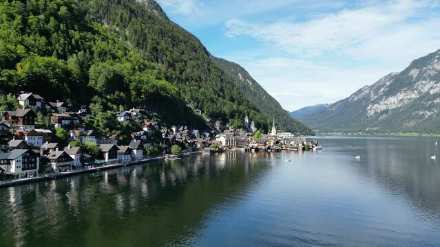 Hallstatt Austria beautiful lakeside village rising crane drone aerial view 4K