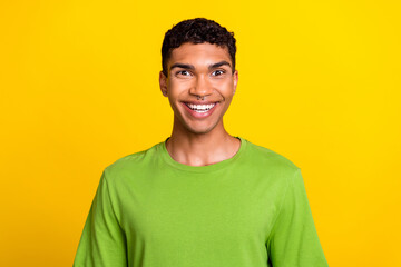 Obraz premium Photo of satisfied astonished person beaming smile have good mood isolated on yellow color background