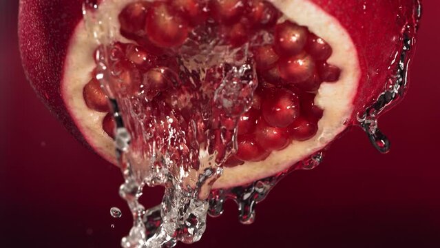 Slow Motion of Flowing Water from Half Pomegranate