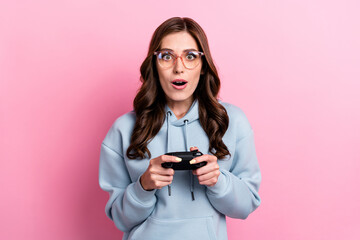 Photo of impressed person hands hold controller play video games unexpected reaction isolated on...