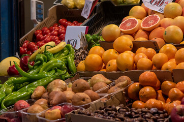 Naklejka na ściany i meble Closeup of a vegetable and fruit stall at a local market grocery shop in Eastern Europ