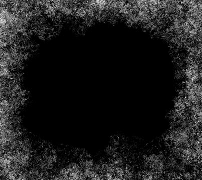 A frame of a frosty pattern  on a black background. A frame with an abstract ice structure allows you to apply or add a frost effect. Frost on the glass, freezing effect