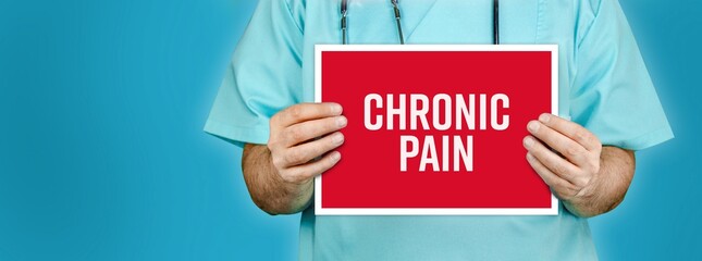 Chronic pain. Doctor shows red sign with medical word on it. Blue background.
