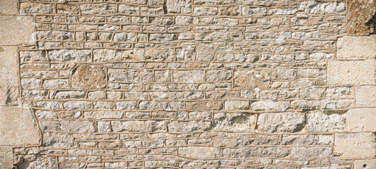 Fototapeta premium Old stone wall pattern or texture, detail of ancient UK church
