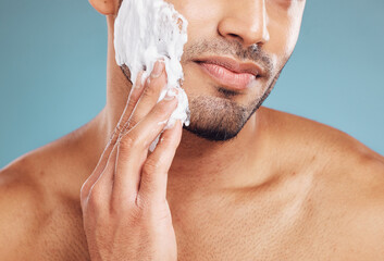 Shaving cream, skincare and skin grooming of a black man busy with beauty and facial routine. Face...