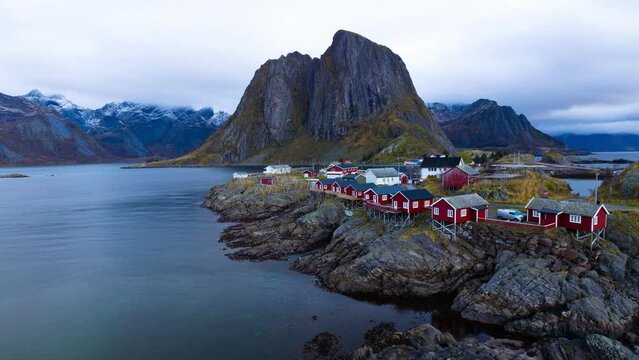 Time lapse of Lofoten village Reine, Norway. Smooth daylight 45 minutes time lapse with beautiful giant mountains and fishermen village.