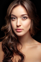 Fototapeta premium Beautiful young woman looking at camera