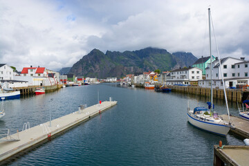 Fototapeta premium Fishing village with traditional wooden houses in Henningsvaer, Lofoten, Norway