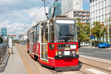 Plakat Streetcar on road in city. Public transport