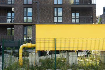 Big yellow gas distribution cabinet in residential area outdoors