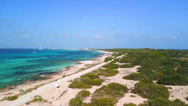 a dream honeymoon destination with caribbean beach. Unbelievable aerial view flight fly reverse drone
of paradis beach Formentera at summer 2022. 4k marnitz Cinematic