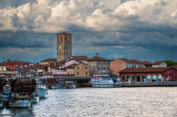 Towards the sunset. Marano lagoon late summer colors. Clouds and sun © Nicola Simeoni