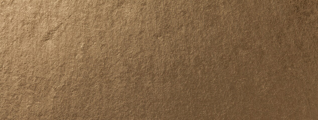 Dark bronze background of natural slate. Texture of rough brown stone backdrop, closeup.