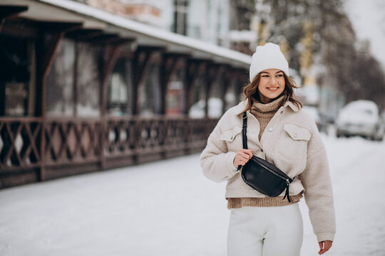Young woman in winter outfit outside the street