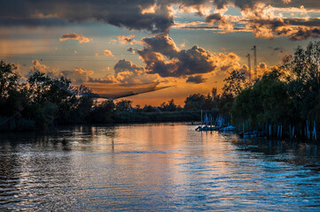 Towards the sunset. Marano lagoon late summer colors. Clouds and sun © Nicola Simeoni