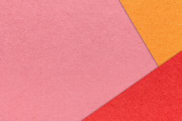Fototapeta premium Craft pink color paper background with red and orange border. Vintage rose cardboard. Presentation template
