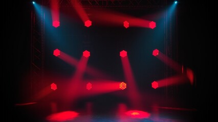 Disco or light show in the dark. Spotlights with red blue bright light illuminate a smoky dark scene. Lighting equipment, lights effects. Lamps for concert lighting. Rays of light in a disco club.