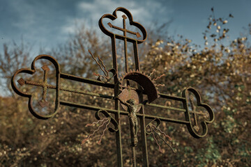 Old cross in the graveyard cemetery