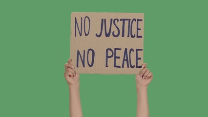 Hands of women raising up cardboard poster NO JUSTICE NO PEACE. Stop Racism concept, No Racism....