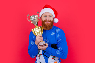 new year goal and win. confused man win a goal in new year. win the trophy. man has goal in new year
