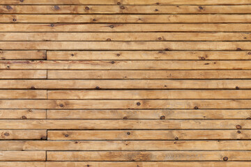 Wooden wall made of uncolored planks, background texture