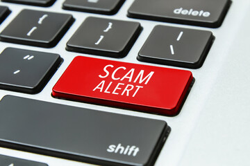 Fototapeta premium Scam Alert information on Computer Keyboard Keys
