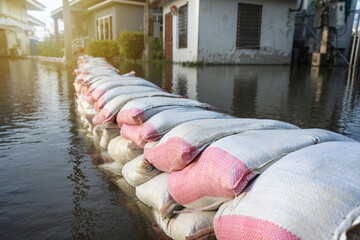 line flood barrier sandbag from the Tha Chin River that overflows in the flood season at Nakhon...