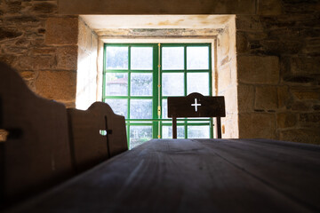 old religious meeting table and window in the background