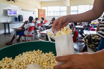  Salty popcorn being served to students at a public school on their return from face-to-face...