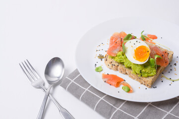 Bread with avocado , vegetables fruit and egg on white background , Healthy breakfast concept