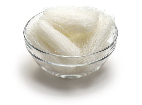 Dried cellophane noodles in a bowl. Cellophane noodles are known as long rice in Hawaii.