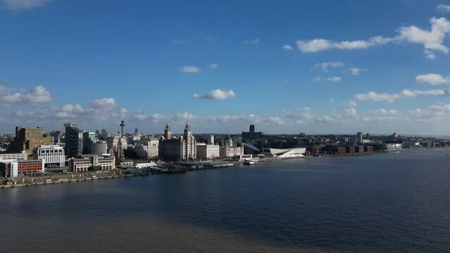 Aerial hyperlapse view of the Liverpool city skyline waterfront and River Mersey, England