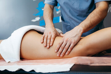 Fototapeta na wymiar Male doctors hands doing anti-cellulite massage