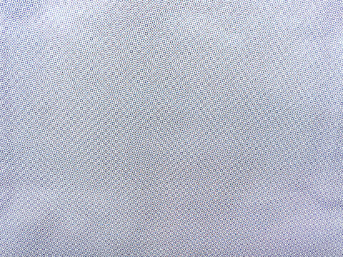 Cmyk halftone dot pattern on print paper as abstract background