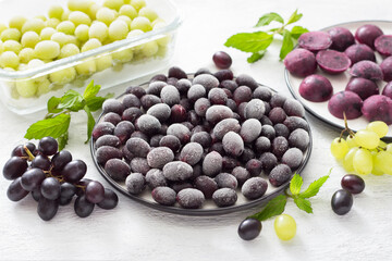 Methods for freezing grapes: bulk frozen, frozen with sugar and frozen puree on a light gray...