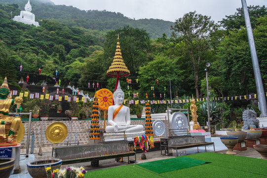 Nakhon Ratchasima..Thailand 13.07.2022.White buddha statue on the mountain in Wat Thep Phithak Punnaram temple Nakhon Ratchasima.