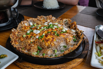 Close up Oyster omelette on the hot pan