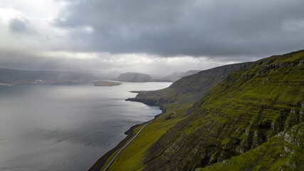 icelandic landscape with bay and mountain with clouds aerial view