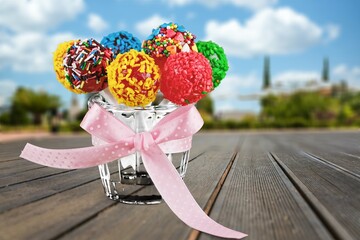 Tasty sweet candy set in bucket on the desk
