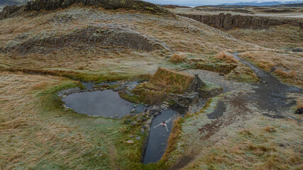 a man person in Hrunalaug Hot Spring 