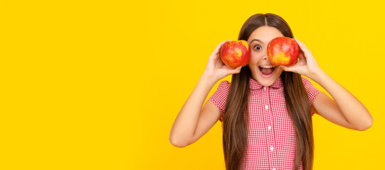 amazed kid hold healthy apple fruit with vitamin. Child girl portrait with apple, horizontal poster. Banner header with copy space.