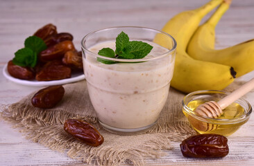 Yogurt with banana date and honey. A healthy drink.
