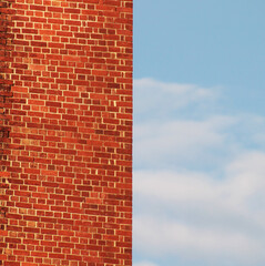 old red brick wall with blue sky