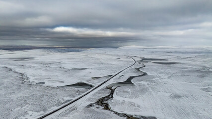 aerial view road in snowy landscape