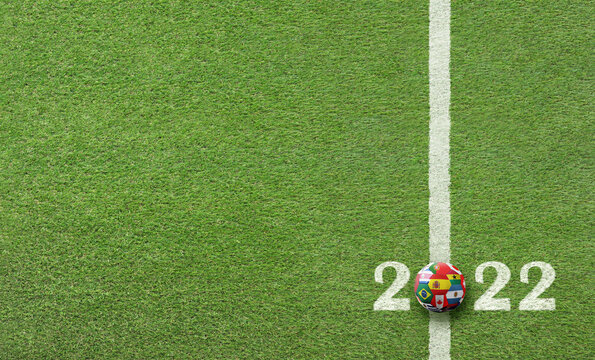 soccer field lawn with ball with flags and text 2022