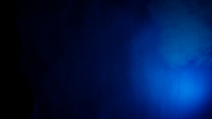 Blue abstract background with natural paper texture and light from one side