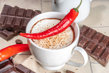 Homemade Holiday Spicy Mexican Hot Chocolate, hot chocolate cocoa drink with whipped cream red chili pepper copy space
