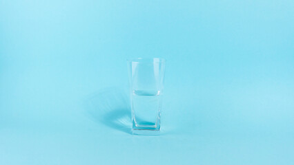 The glass is half empty or full. A glass transparent glass is filled with water. The concept of an...